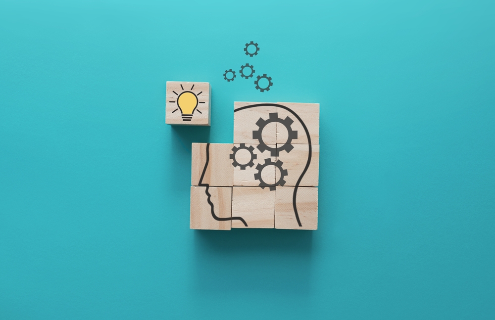 Brain with gears missing piece and bright idea completes the brain from shutterstock.com